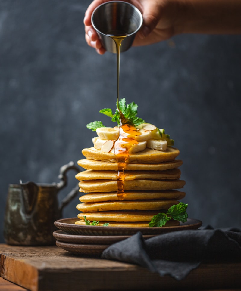 Stack of golden pancakes with berries